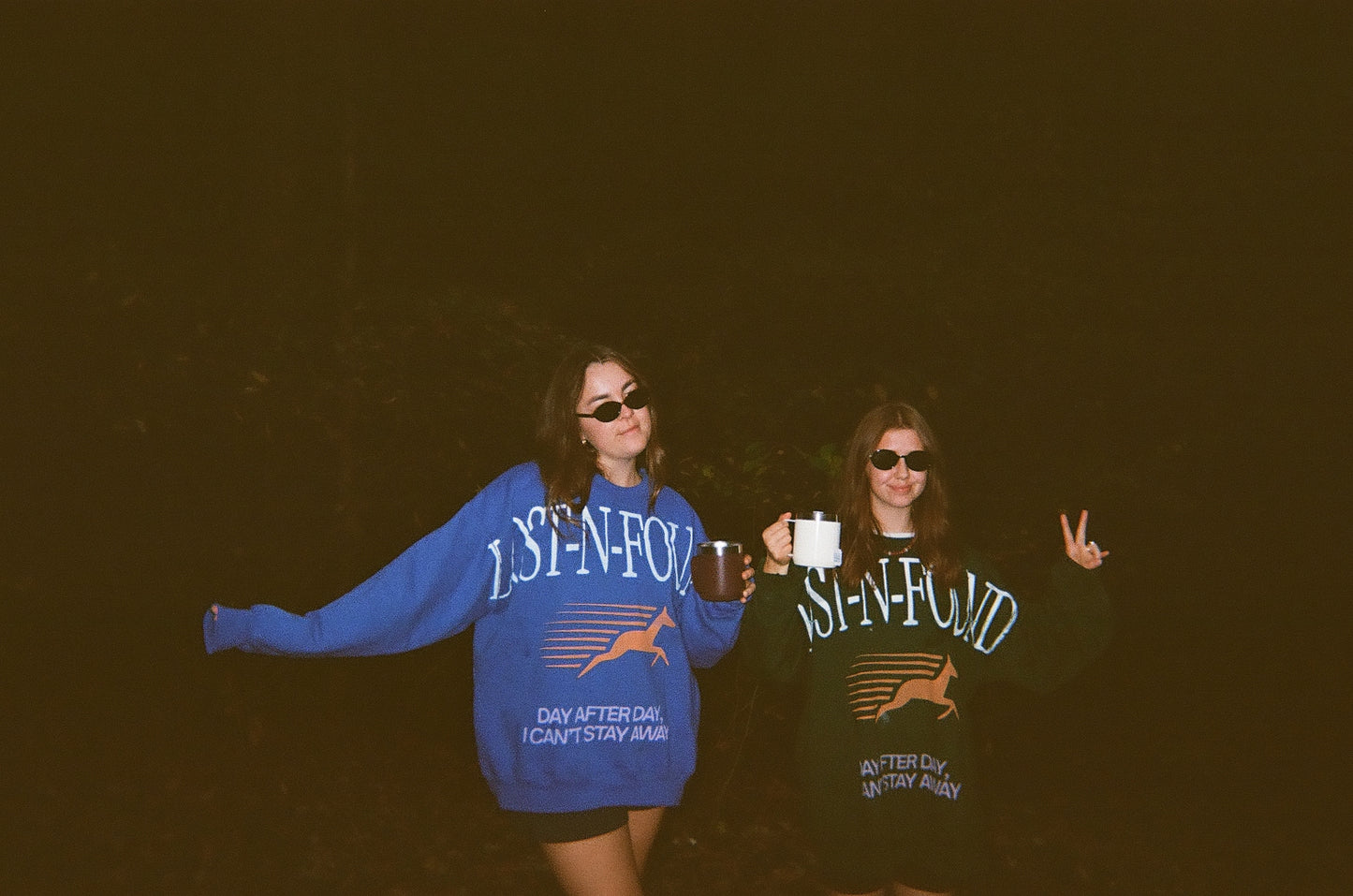Two people wearing LOST-N-FOUND sweatshirts